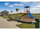 Community playground with slide and benches at 2777 Flushing Dr, Apopka, FL 32703