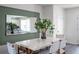 Bright dining room with white table, woven chairs, and a large mirror at 2781 Flushing Dr, Apopka, FL 32703