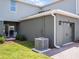 Exterior view of home with garage and AC unit at 2781 Flushing Dr, Apopka, FL 32703