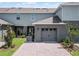 Exterior view of home with garage and landscaping at 2781 Flushing Dr, Apopka, FL 32703