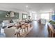 Modern living room with L-shaped sofa, neutral color scheme, and access to a patio at 2781 Flushing Dr, Apopka, FL 32703