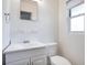 Clean bathroom with white vanity, toilet and window at 2842 Eastern Pkwy, Winter Park, FL 32789