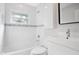 Modern bathroom with white tile and updated fixtures at 2842 Eastern Pkwy, Winter Park, FL 32789