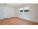 Bedroom with wood floors, double closets and window at 2842 Eastern Pkwy, Winter Park, FL 32789