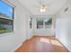 Bright bonus room with wood floors and multiple windows at 2842 Eastern Pkwy, Winter Park, FL 32789