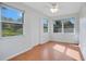 Bright bonus room with wood floors and multiple windows at 2842 Eastern Pkwy, Winter Park, FL 32789