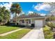 Charming ranch home with stone exterior, spacious yard, and a two-car driveway at 2842 Eastern Pkwy, Winter Park, FL 32789