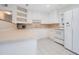 White kitchen with ample counter space and built-in shelving at 2842 Eastern Pkwy, Winter Park, FL 32789