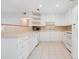 White kitchen with ample counter space and built-in shelving at 2842 Eastern Pkwy, Winter Park, FL 32789