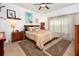 Comfortable bedroom with king-size bed and wood furniture at 300 Sorrento Rd, Poinciana, FL 34759