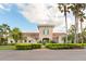 Community clubhouse with Spanish-style architecture and landscaping at 300 Sorrento Rd, Poinciana, FL 34759