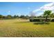 Serene golf course view with lush landscaping at 300 Sorrento Rd, Poinciana, FL 34759