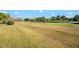 Scenic golf course view with a pond at 300 Sorrento Rd, Poinciana, FL 34759