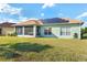 House with solar panels, screened porch, and large backyard at 300 Sorrento Rd, Poinciana, FL 34759