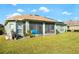 House with solar panels, screened porch, and large backyard at 300 Sorrento Rd, Poinciana, FL 34759