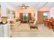 Spacious living room with adjacent dining area at 300 Sorrento Rd, Poinciana, FL 34759