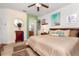 Spacious main bedroom with king-size bed and ensuite bathroom at 300 Sorrento Rd, Poinciana, FL 34759