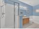 Blue bathroom with a shower and a separate tub at 306 Kettering Rd, Davenport, FL 33897