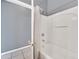 Gray bathroom with a tub and shower at 306 Kettering Rd, Davenport, FL 33897