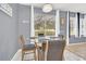 Kitchen dining area with glass table and sliding door to patio at 306 Kettering Rd, Davenport, FL 33897