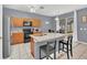 Modern kitchen with granite countertops, stainless steel appliances, and island at 306 Kettering Rd, Davenport, FL 33897