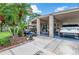 Covered entry with golf cart and Range Rover at 322 Apopka St, Winter Garden, FL 34787