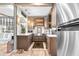 Modern kitchen with a farmhouse sink and wooden cabinets at 322 Apopka St, Winter Garden, FL 34787