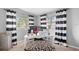 Home office with black and white striped curtains and ample natural light at 322 Apopka St, Winter Garden, FL 34787