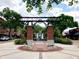 Centennial Plaza entrance with brick pillars and a central fountain at 322 Apopka St, Winter Garden, FL 34787