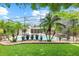 Screened pool and patio with lush landscaping at 322 Apopka St, Winter Garden, FL 34787