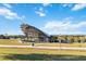 Outdoor amphitheater with a modern metal roof structure and tiered seating at 332 Apopka Hills Cir, Apopka, FL 32703