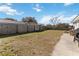 Large backyard with wooden fence and patio at 332 Apopka Hills Cir, Apopka, FL 32703