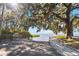 Boat ramp with a wooden dock and informational kiosk located in a lush park setting at 332 Apopka Hills Cir, Apopka, FL 32703