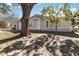 Gray house with white trim, driveway and landscaping at 332 Apopka Hills Cir, Apopka, FL 32703