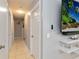 Bright hallway with light gray walls and tile floors at 332 Apopka Hills Cir, Apopka, FL 32703