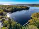 Aerial view of a river with docks and lush foliage at 360 Belmond Dr, Debary, FL 32713