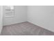 Simple bedroom with grey carpet at 360 Belmond Dr, Debary, FL 32713