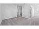 Empty bedroom with grey carpet and ensuite bathroom at 360 Belmond Dr, Debary, FL 32713