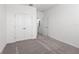 Bright bedroom with gray carpet and double doors to closet at 360 Belmond Dr, Debary, FL 32713