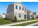 Side view of a two-story house with gray siding and landscaping at 360 Belmond Dr, Debary, FL 32713