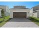 Brown garage door and brick paver driveway at 360 Belmond Dr, Debary, FL 32713