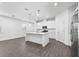 Modern kitchen with white cabinets and an island at 360 Belmond Dr, Debary, FL 32713