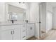 Bathroom with white cabinets, quartz countertop, and modern fixtures at 4670 Sw 142Nd Place Rd, Ocala, FL 34473