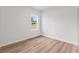 Bright bedroom featuring light walls and wood-look flooring at 4670 Sw 142Nd Place Rd, Ocala, FL 34473