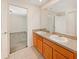 Double vanity bathroom with a view into a bedroom at 4957 Rock Rose Loop, Sanford, FL 32771