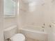 Simple bathroom with a shower/tub combo and toilet at 4957 Rock Rose Loop, Sanford, FL 32771