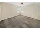 Simple bedroom with neutral walls and gray carpeting at 4957 Rock Rose Loop, Sanford, FL 32771