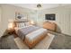 Light filled bedroom with wood bed frame and built in dresser at 4957 Rock Rose Loop, Sanford, FL 32771