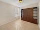 Small bedroom with tile flooring and built in shelving at 4957 Rock Rose Loop, Sanford, FL 32771