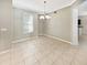 Bright dining room featuring tile floors and a chandelier at 4957 Rock Rose Loop, Sanford, FL 32771